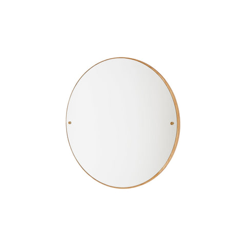 Frama CM-1 Circle Mirror, round mirror with a slim oak rim and two brass fixings, hung small on a plain white wall