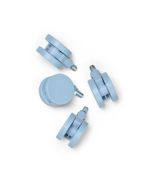 Pedestal Wheels in Powder Blue, set of four furniture wheels, on a plain white background