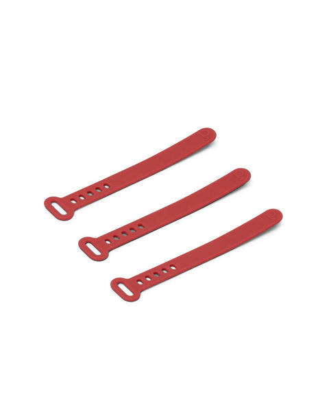 Pedestal Cable Tie in Burnin' Red, three silicone cable ties laid side by side, on a plain white background