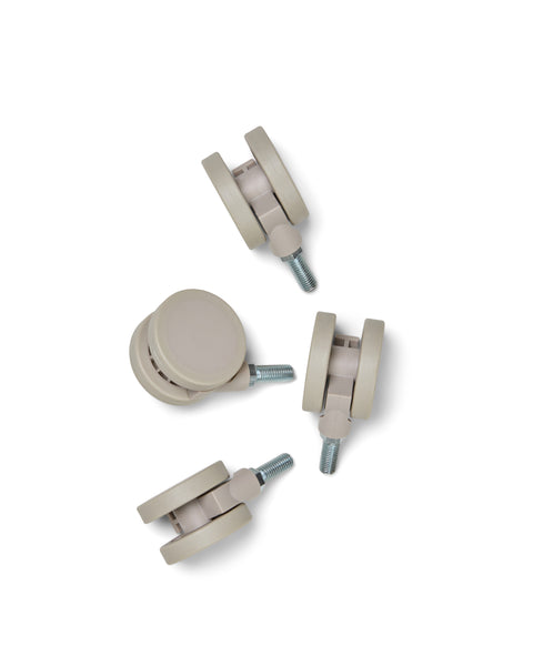 Pedestal Wheels in Oat, set of four furniture wheels, on a plain white background