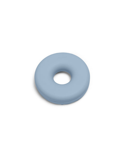 Pedestal Cable Bagel in Powder Blue, silicone cable organizer ring, on a plain white background