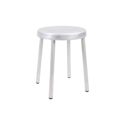 Frama Tasca Stool in Aluminum, stool with a round seat and four tapered legs, small in frame on a pale background