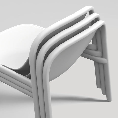 Blu Dot Decade Lounge Chair in white recycled plastic, close-up showing three chairs stacked together demonstrating the stackable design