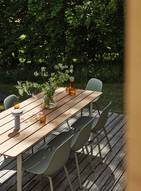 scandinavian outdoor dining table with wood slats by muuto 