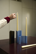 Muuto Pair Candleholder in brown and light blue anodized aluminum with tall candles, Scandinavian modern table setting