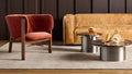 Blu Dot Cleon 96" Sofa in camel leather styled in a warm moody living room with marble coffee tables