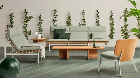 NowThen Outdoor Coffee Table by Blu Dot in FSC-certified solid teak, styled in outdoor lounge setting