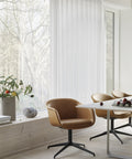 scandinavian dining room with leather dining chair and white dining table by muuto 