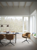 scandinavian leather dining chair in minimalist dining room by muuto 