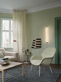 Muuto Leaf Floor Lamp casting ambient light in a stylish apartment.