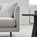 detail image of scandinavian sofa in grey fabric and black metal legs 