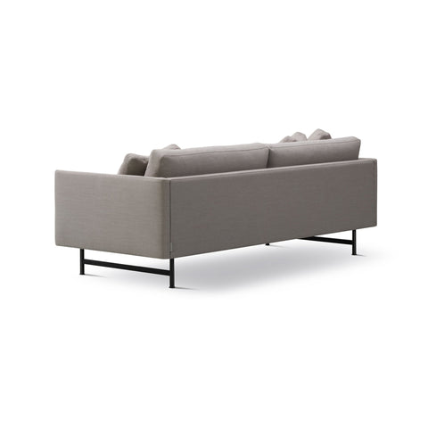calmo sofa by fredericia furniture in grey fabric and black metal legs 