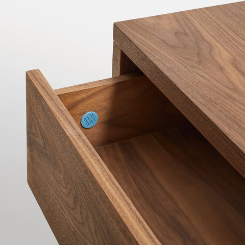 Blu Dot Go Forth Bench in walnut with hidden soft-close drawer open, showing interior detail.