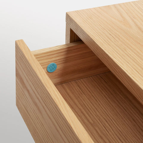 Blu Dot Go Forth Bench in white oak with hidden drawer open, showing interior detail.