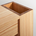 Blu Dot Go Forth Bench in white oak, close-up of side umbrella storage compartment.
