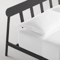 Blu Dot Goodie Bed in Oblivion black, close-up detail of slatted headboard and frame leg.