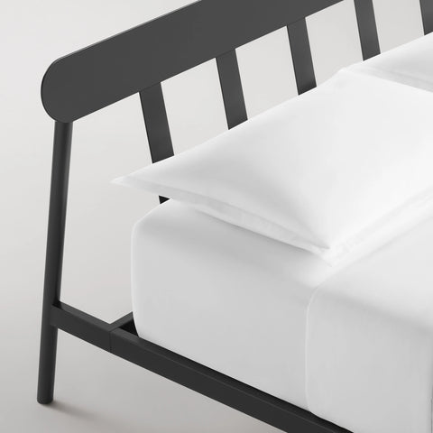 Blu Dot Goodie Bed in Oblivion black, close-up detail of slatted headboard and frame leg.