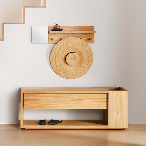 Blu Dot Go Forth Bench in white oak styled in entryway with wall-mounted coat rack and hat.