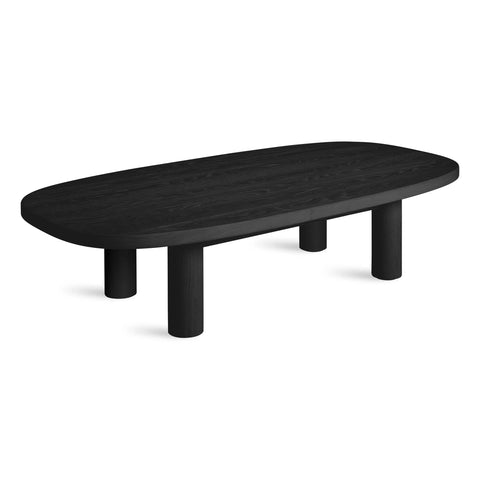 Blu Dot Good Times coffee table in black oak with rounded oval top and four cylindrical pillar legs
