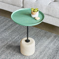 Gus* Modern Agency Table, round side table, Robusta green top with a plant beside a grey sofa
