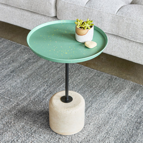 Gus* Modern Agency Table, round side table, Robusta green top with a plant beside a grey sofa