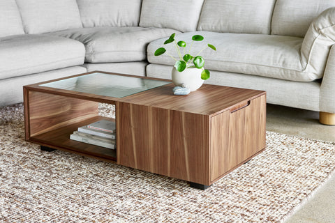 Gus* Modern Conway Coffee Table, walnut storage coffee table in front of a light sofa on a textured rug