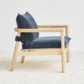 Gus* Modern Humber Lounge Chair, ash lounge chair, Regency Nautica navy cushions on a light rug