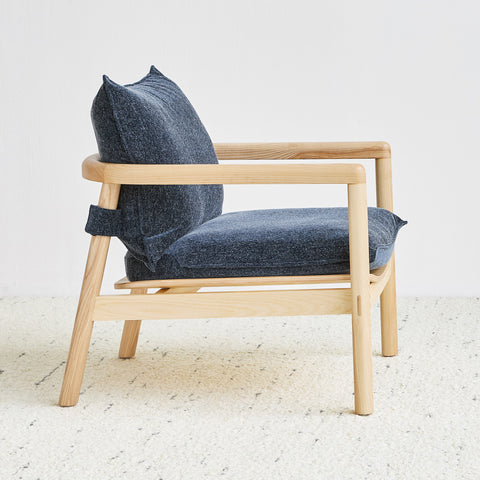 Gus* Modern Humber Lounge Chair, ash lounge chair, Regency Nautica navy cushions on a light rug