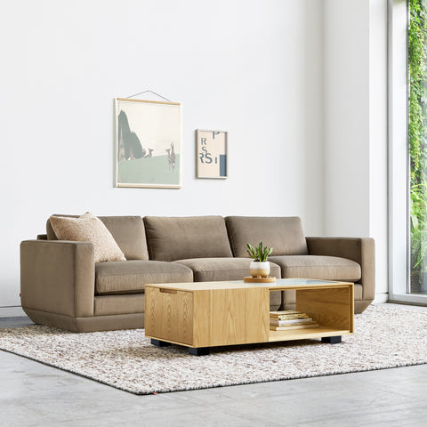 Gus* Modern Podium 3PC Sofa, modular sofa, Merino Mocha taupe with a light wood coffee table in a bright room