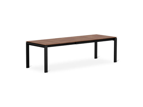 Gus* Modern Revell Extendable Dining Table, extendable walnut dining table, Walnut fully extended, three-quarter view on white