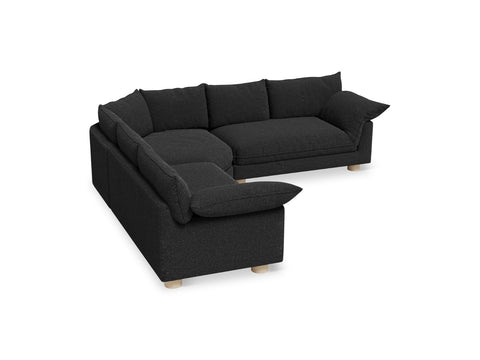 Gus* Modern Zoe Bi-Sectional, upholstered corner sectional sofa, Node Nocturne charcoal fabric, three-quarter view on white
