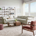 Gus* Modern Zoe Bi-Sectional, corner sectional sofa, Sutton Canvas cream in a living room with a wood coffee table and leather chair