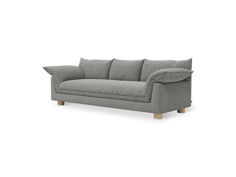 Gus* Modern Zoe Sofa, upholstered three seat sofa, Rosslyn Legacy grey fabric with oak legs, three-quarter view on white