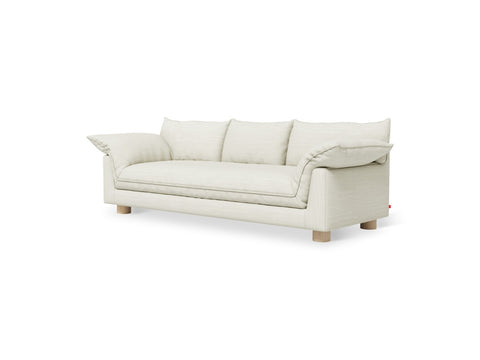 Gus* Modern Zoe Sofa, upholstered three seat sofa, Sutton Canvas cream fabric with oak legs, three-quarter view on white