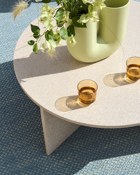 Muuto Halves Coffee Table in light taupe terrazzo with Kink vase and glassware on Ply rug