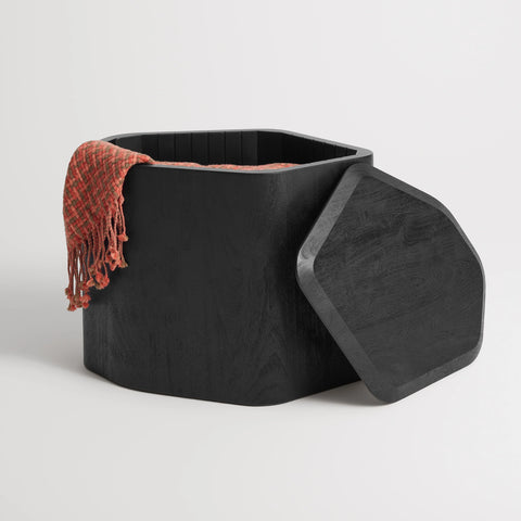 Black-stained acacia Hoard Tall Side Table with Storage with the removable top set aside, revealing a throw blanket inside