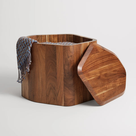 Acacia Hoard Tall Side Table with Storage by Blu Dot with the removable beveled top set aside, revealing a throw blanket inside