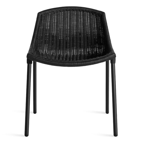 modern black rattan dining chair with stainless steel legs by blu dot