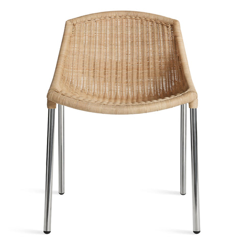 modern natural rattan dining chair with stainless steel legs by blu dot