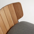 Low Fade Outdoor Lounge Chair by Blu Dot, curved FSC-certified teak backrest and Toohey Charcoal cushion detail
