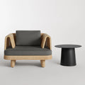 Loophole Outdoor Lounge Chair by Blu Dot in Toohey Charcoal, front view with Circula side table