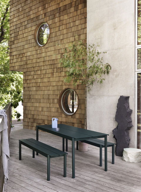 metal dark green minimalist outdoor dining table and benches by muuto 