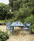 modern outdoor dining table in pale blue by muuto 