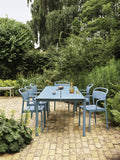 modern outdoor dining table in pale blue by muuto 