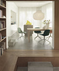 wood panel wall dining room interior with furniture and lighting by muuto