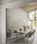 scandinavian modern interior with concrete walls and oak dining table