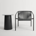 Lookout Outdoor Lounge Chair by Blu Dot in carbon, styled with outdoor side table