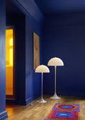 Louis Poulsen Panthella 400 Floor Lamp, white opal acrylic floor lamp beside the Panthella Floor Lamp in a deep blue room