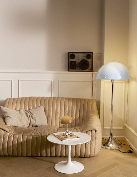 Louis Poulsen Panthella Floor Lamp, Original Opal Blue Grey floor lamp beside a beige sofa, with a Panthella portable lamp on a side table