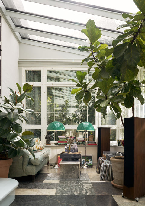Louis Poulsen Panthella Floor Lamp, two Original Opal Green floor lamps in a glass-roofed conservatory with large plants